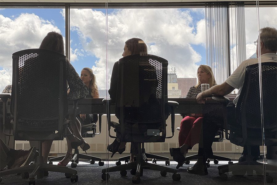 Engage Our Team - Closeup View of a Group of Armada Risk Partners Team Members Sitting in the Office During a Business Conference